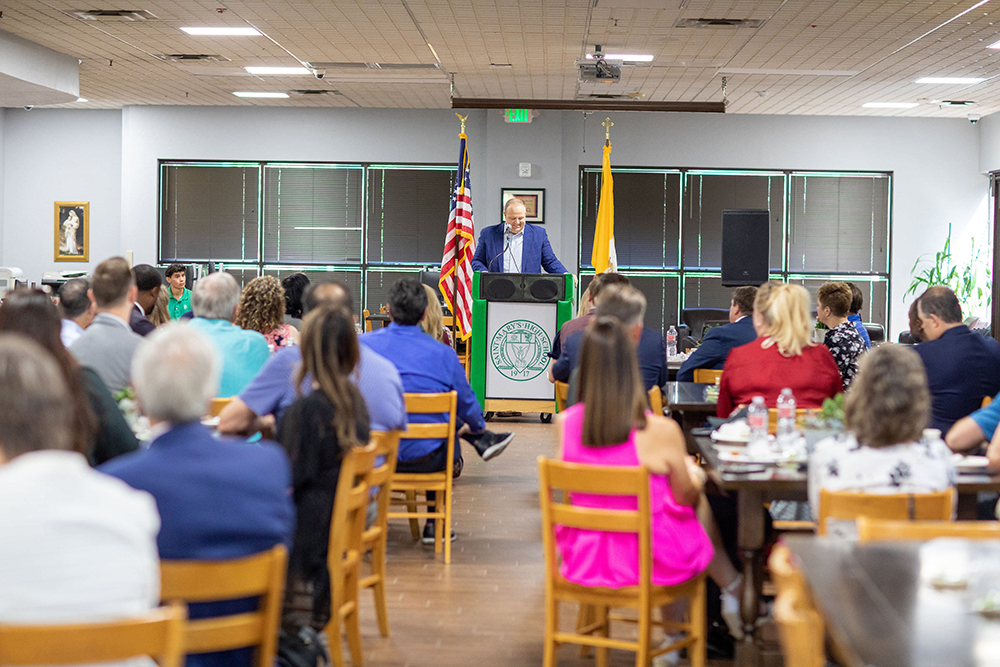 Aaron Muth addressing the audience during the Corporate Champions Breakfast